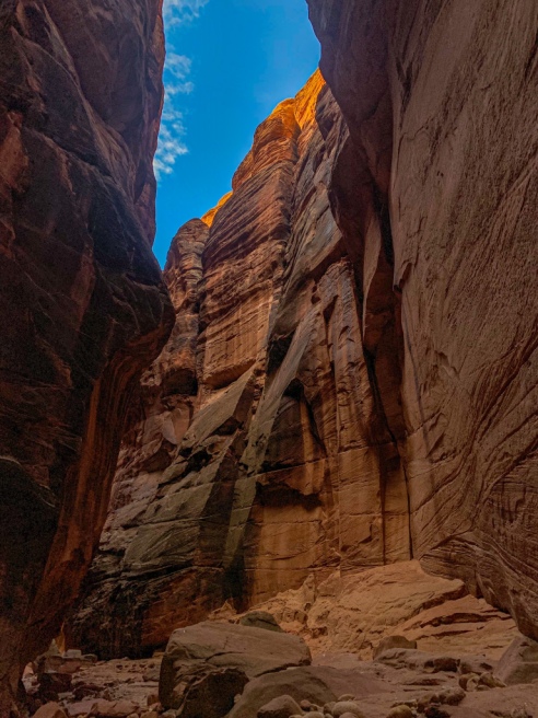 Low angled light illuminated the crest of the soaring rock walls of Buckskin Gulch slot canyon on the Arizona-Utah border.